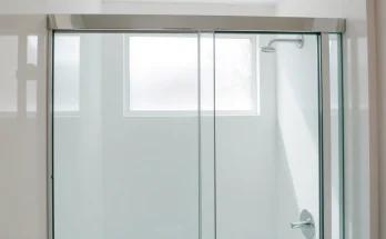 Beautiful sliding shower doors elevating a modern bathroom with sleek design and style.
